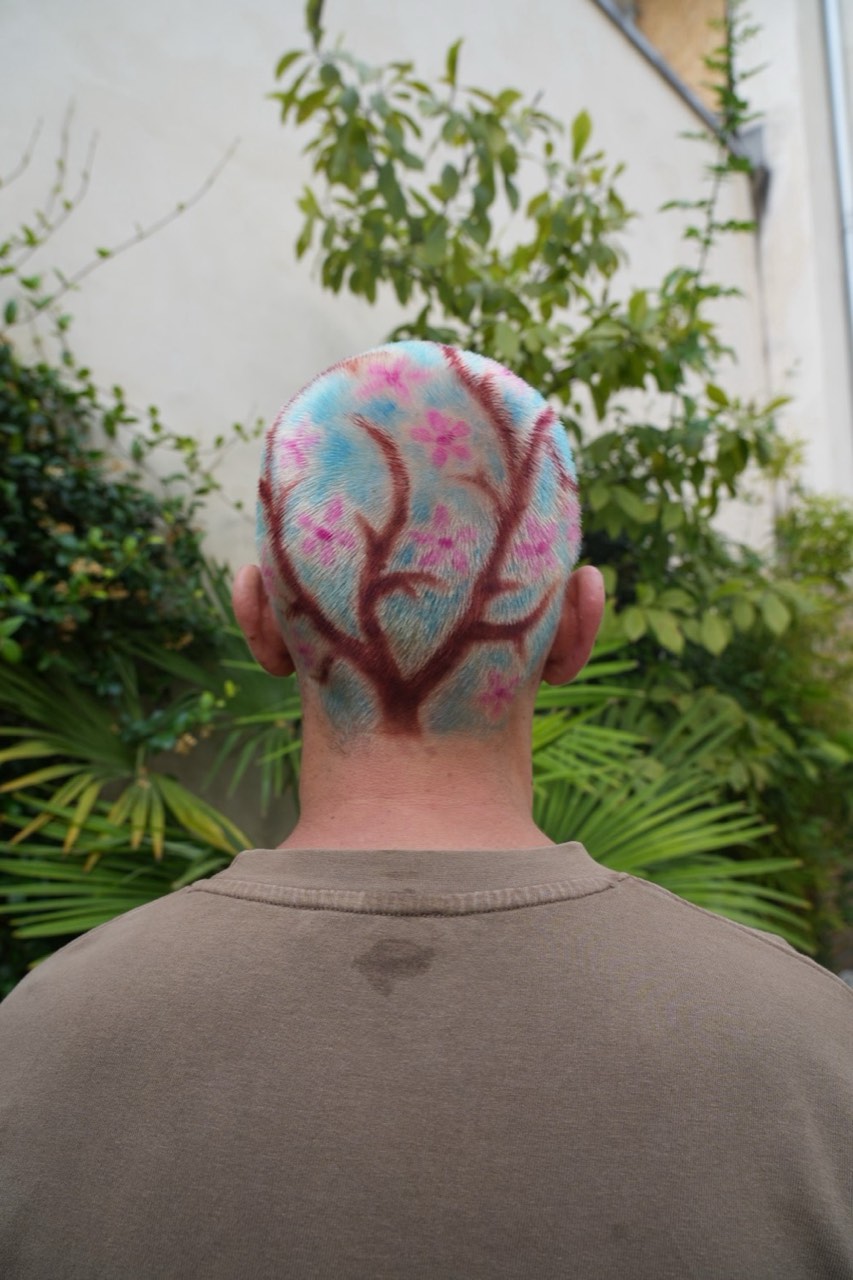 Cherry blossom hair art coloured across the head, in a Paris garden
